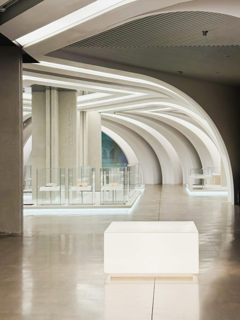 Sleek, modern design with illuminated arches in a Seoul museum.